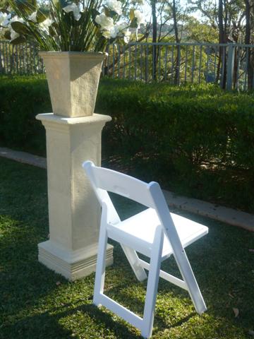 white padded folding chair